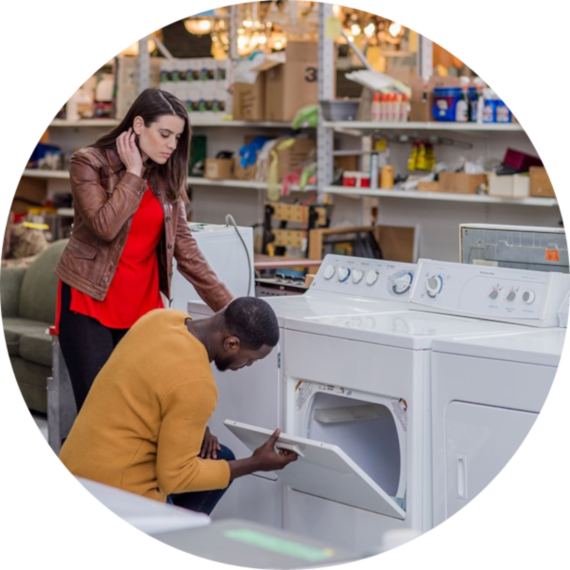 ReStore customers looking at machine washers and dryers 