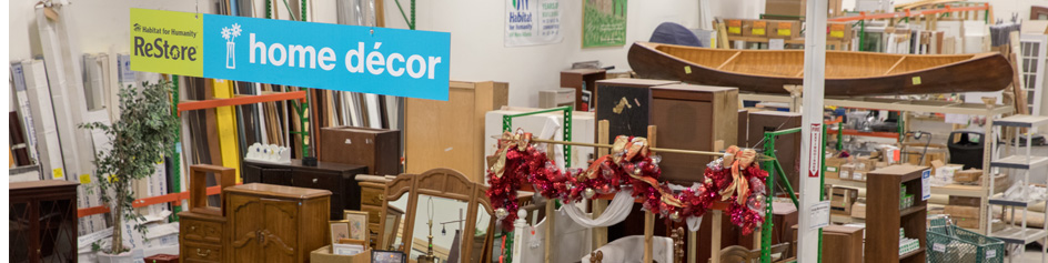inside of a ReStore with furniture and signs for home décor 
