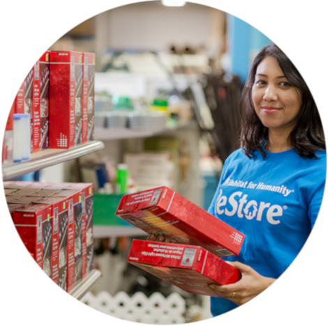 ReStore worker stocking shelves