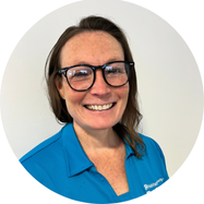 Doug wearing a navy Zip up sweater 